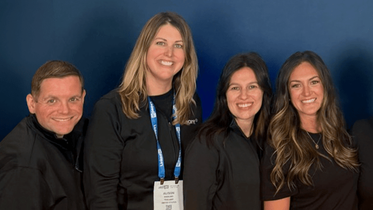 Traliant team members gathered for a group selfie
